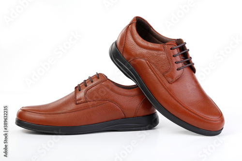 Classic brown leather shoes on a white background