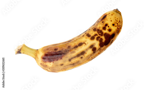 One overripe banana on white isolated background photo