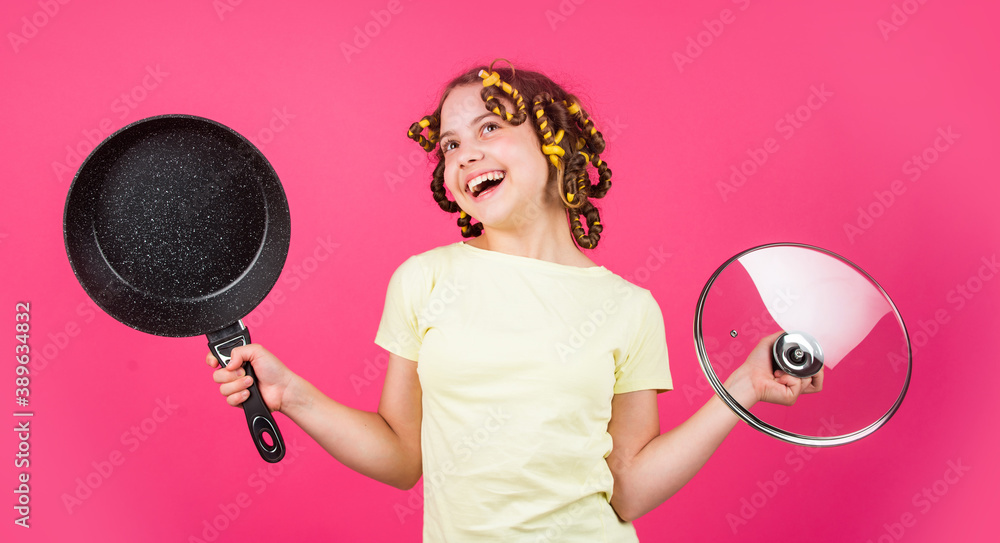 just inspired. little woman hold pan. cooking in kitchen. concept of household. child cook at home. happy childhood. cheerful kid with hair curlers papillotes. housekeeping from childhood just inspired. little woman hold pan. cooking in kitchen. concept of household. child cook at home. happy childhood. cheerful kid with hair curlers papillotes. housekeeping from childhood