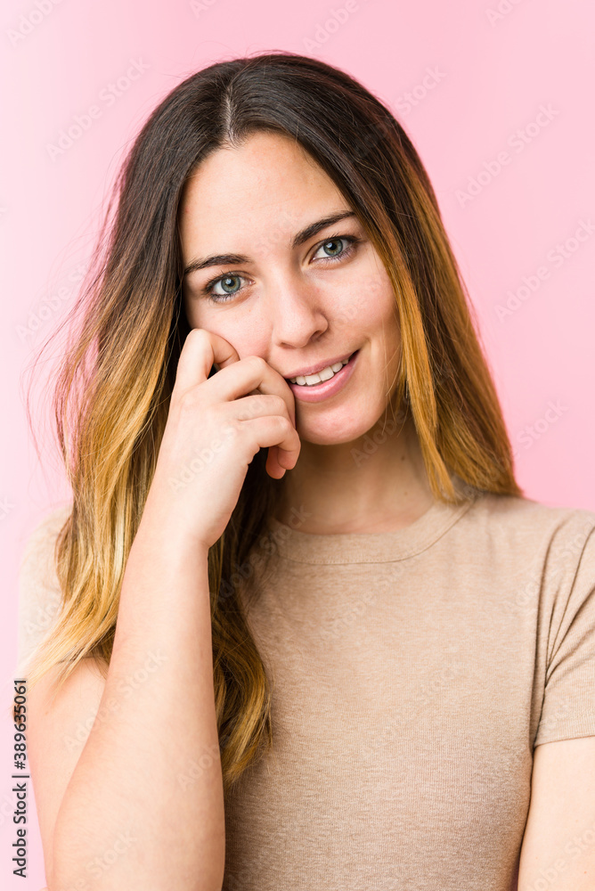 Young beautiful woman isolated on pink background Young beautiful woman isolated on pink background