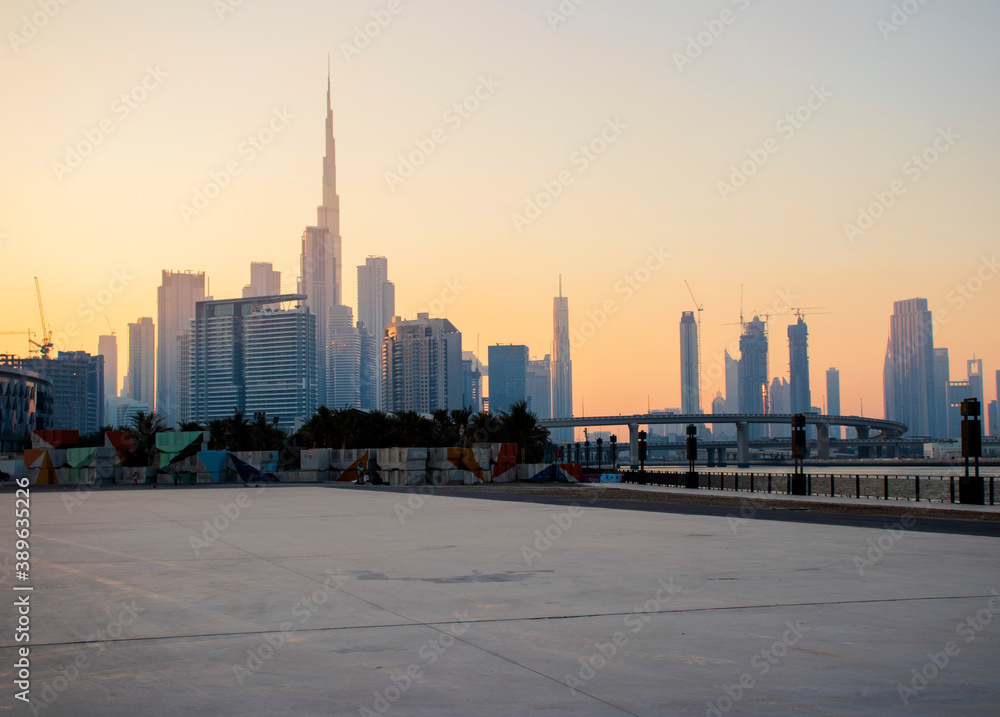 View of a Dubai city skyline during sunset hour. UAE.