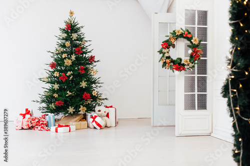 Christmas tree pine with gifts for the new year decor interior red white