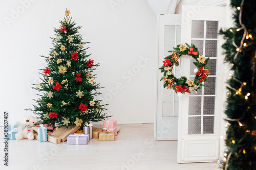 Garland Christmas tree pine with gifts for the new year decor interior red white