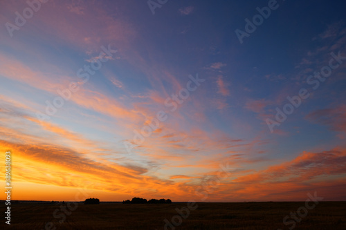 sunset of the red sun on a variegated colored sky