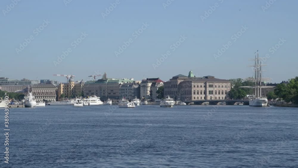 Commuting steamboats and motor boats arriving and leaving Stockholm inner harbor for the archipelago a sunny midsummer day Commuting steamboats and motor boats arriving and leaving Stockholm inner harbor for the archipelago a sunny midsummer day