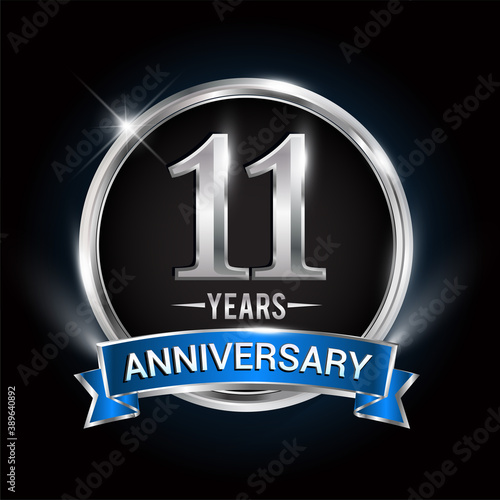 Celebrating 11th years anniversary logo with silver ring and blue ribbon.
