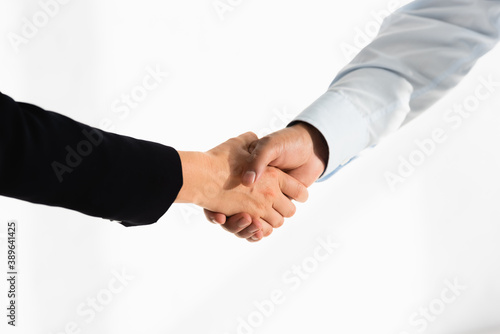 cropped view of politicians shaking hands on white