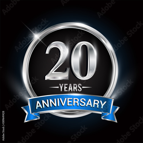 Celebrating 20th years anniversary logo with silver ring and blue ribbon.