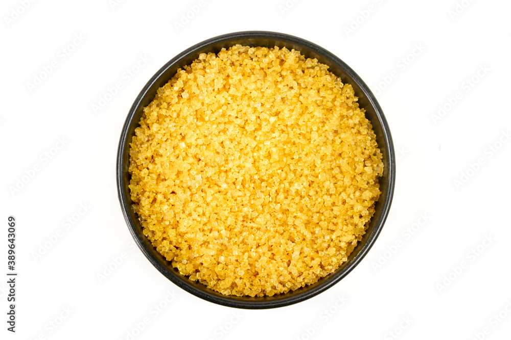 Sugar from sugarcane in black bowl isolated on white background, Top view. Sugar from sugarcane in black bowl isolated on white background, Top view.