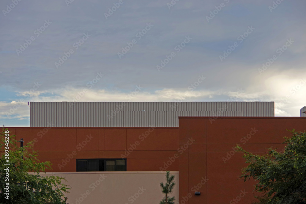 Fototapeta premium Low angle view of the upper part of a section of a building under a vivid autumn sky
