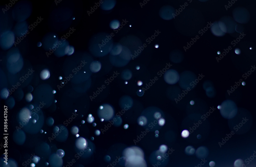 Photo of bokeh design light style new blue theme or cool color abstract pattern blurred background used in Christmas and New Year or celebretion.