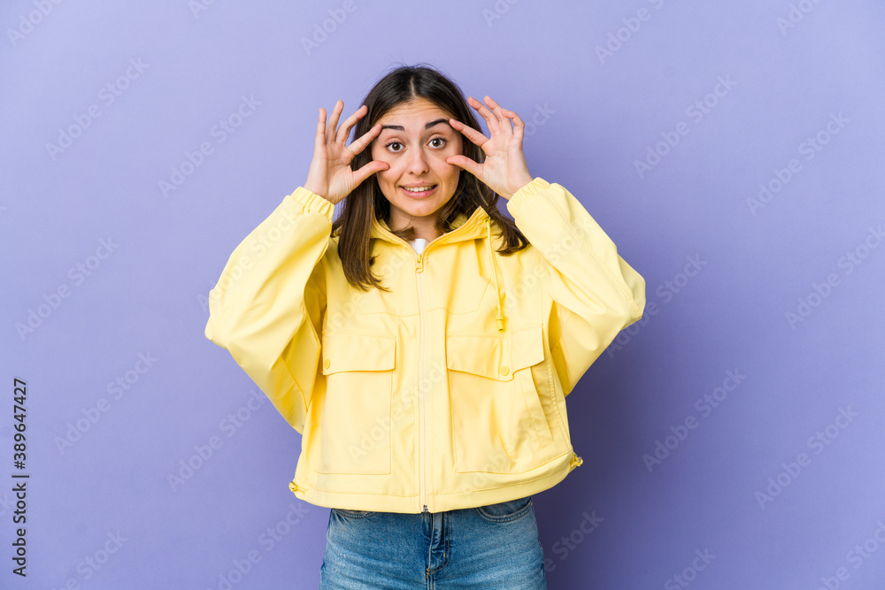 Young caucasian woman keeping eyes opened to find a success opportunity. Young caucasian woman keeping eyes opened to find a success opportunity.