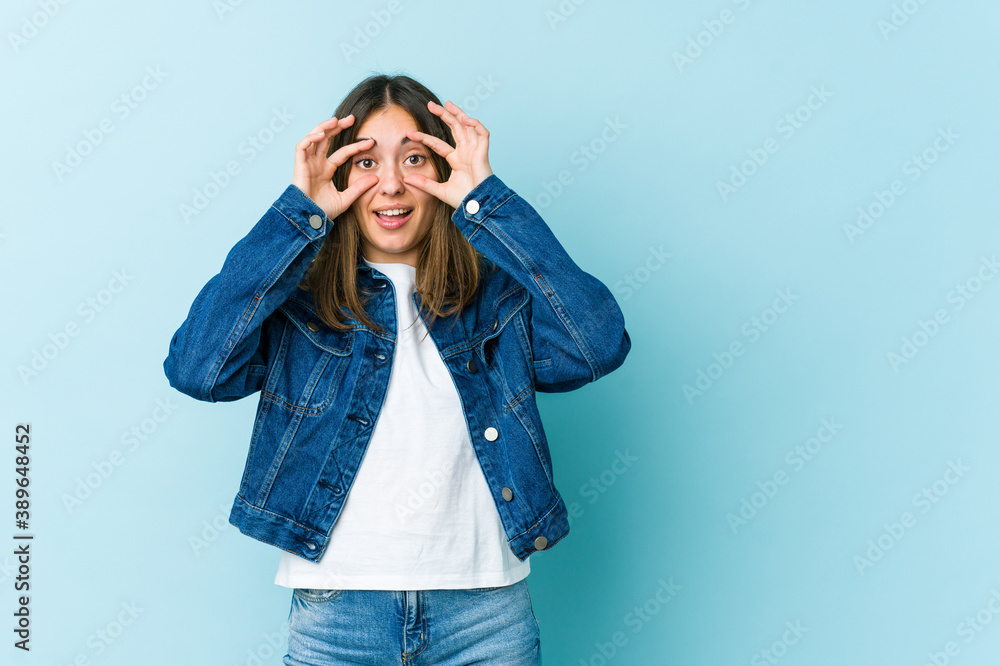 Young caucasian woman keeping eyes opened to find a success opportunity. Young caucasian woman keeping eyes opened to find a success opportunity.
