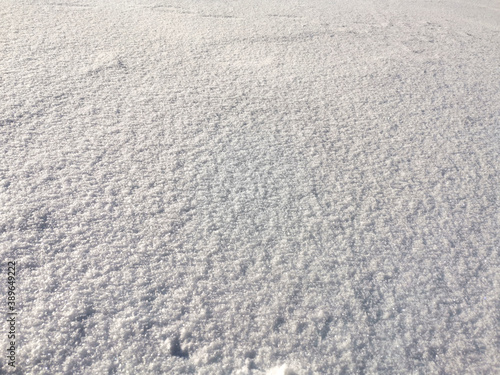 texture of clean white sparkling snow surface. Winter background