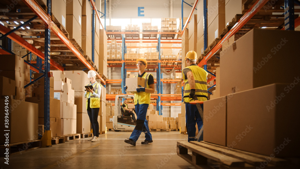 Retail Warehouse full of Shelves with Goods in Cardboard Boxes, Workers Scan and Sort Packages, Move Inventory with Pallet Trucks and Forklifts. Product Distribution Logistics Center. Retail Warehouse full of Shelves with Goods in Cardboard Boxes, Workers Scan and Sort Packages, Move Inventory with Pallet Trucks and Forklifts. Product Distribution Logistics Center.