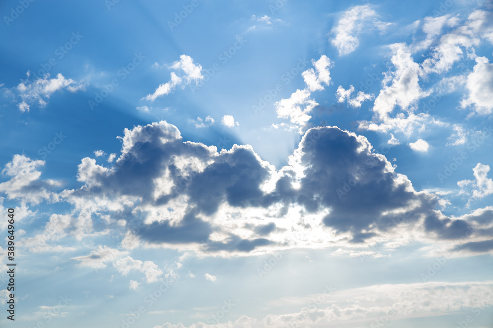 Fototapeta premium White clouds on blue dramatic sky Sunbeam, background look abstract nature.