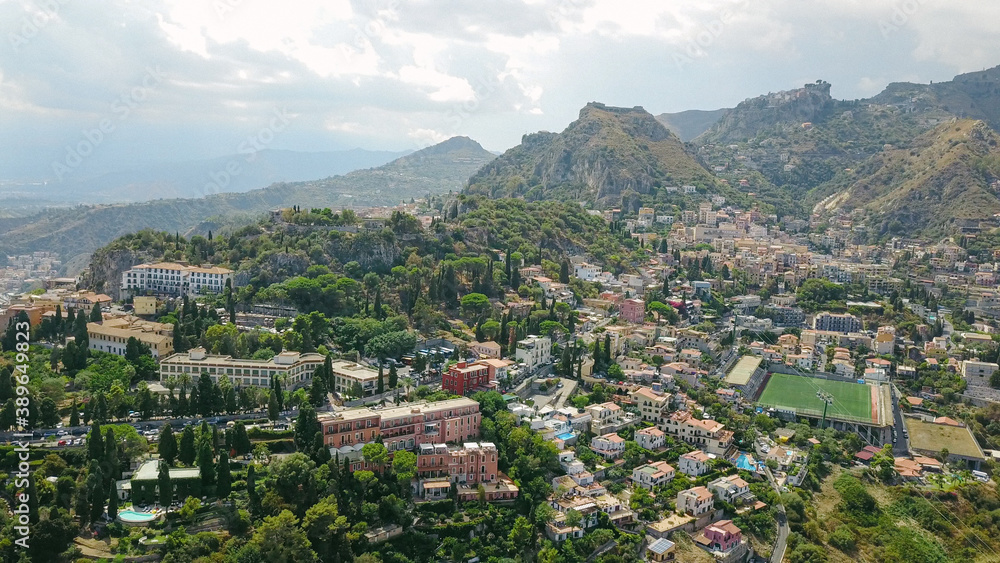 View over the city of Taormina, Italy, houses on the hills