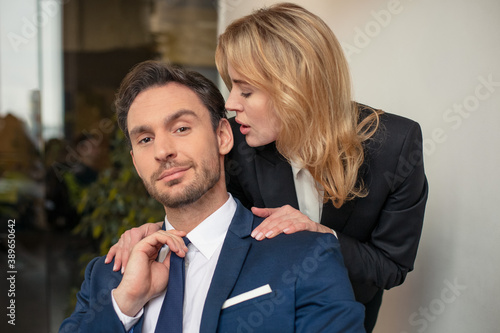 A novel at work. The boss molests his subordinate employee. Sexual harassment. High quality photo