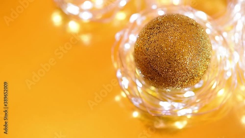 Golden Christmas bokeh from light and twinkling garlands blurred focus . background video of the winter holiday