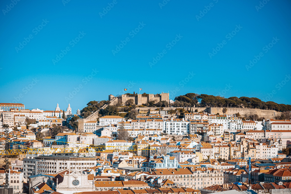 Lisbon, Portugal.- February 11, 2018: Old Town Lisbon. Street view of typical houses in Lisbon, Portugal, Europe