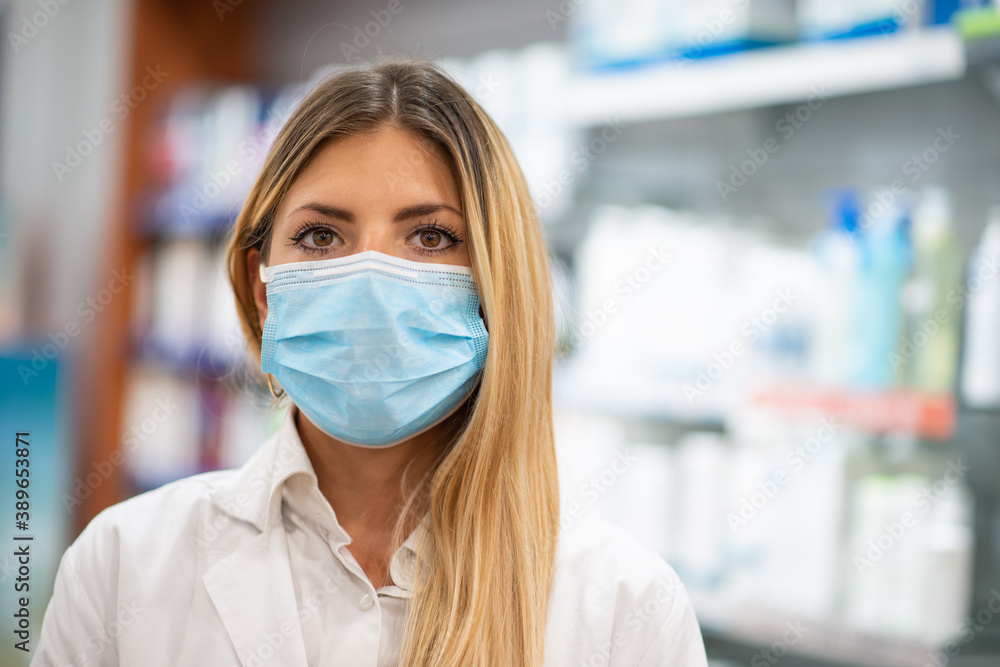 Female pharmacist wearing a coronavirus covid mask Female pharmacist wearing a coronavirus covid mask