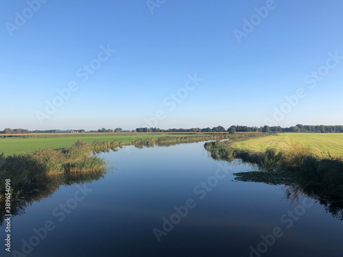 Quiet canal around tersoal in Friesland