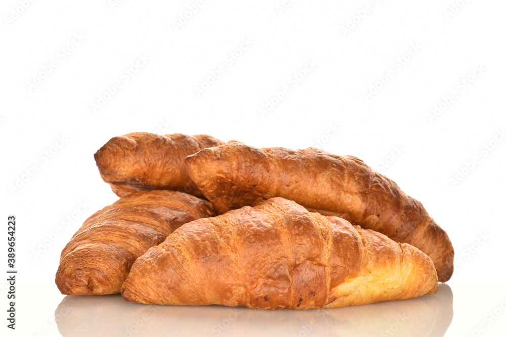 Fragrant homemade croissant, close-up, on a white background.