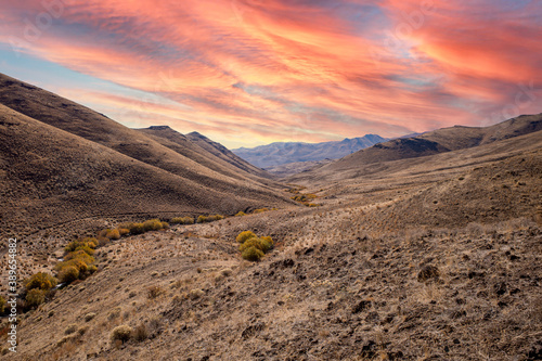 Desert landscape during autumn with a dramatic cloudy sky.