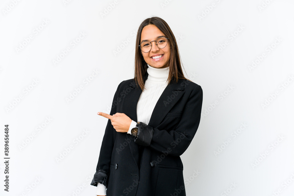 Young mixed race business woman isolated on white background smiling and pointing aside, showing something at blank space. Young mixed race business woman isolated on white background smiling and pointing aside, showing something at blank space.