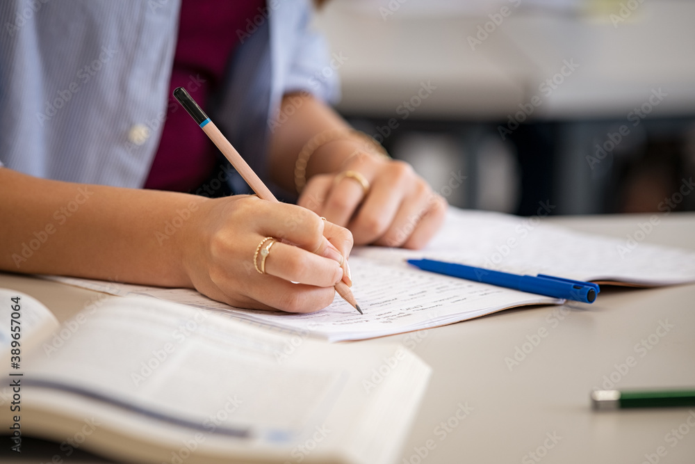 Student hand writing on notebook Student hand writing on notebook