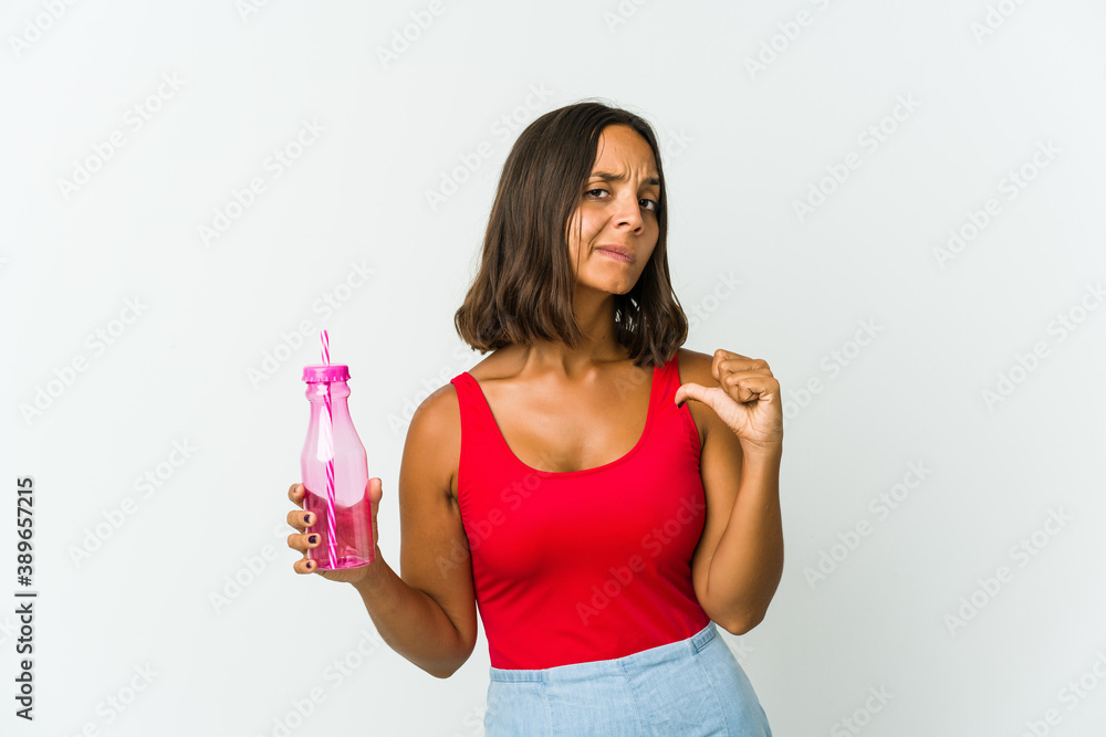 Young latin woman holding a milkshake isolated on white background Young latin woman holding a milkshake isolated on white background