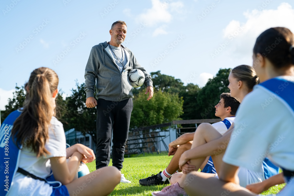 © Rido - Football coach training student players at college © Rido - Football coach training student players at college