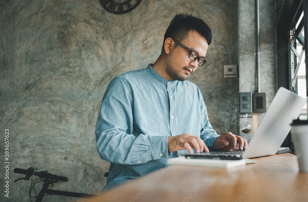 smart Asian man working with computer laptop. concept work form home, stay at home. freelance life style. smart Asian man working with computer laptop. concept work form home, stay at home. freelance life style.