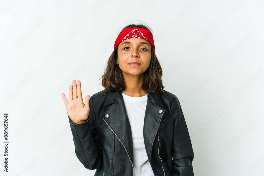 Young latin rocker woman isolated on white background Young latin rocker woman isolated on white background