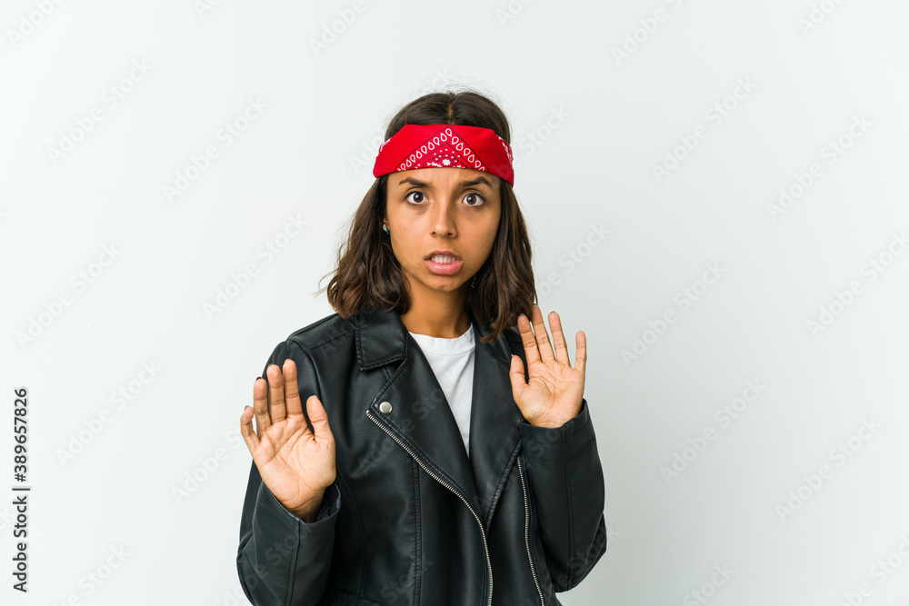 Young latin rocker woman isolated on white background Young latin rocker woman isolated on white background