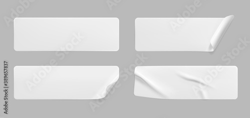 White glued crumpled stickers with curled corners mock up set. Blank white adhesive paper or plastic sticker label with wrinkled and creased effect. Template label tags close up. 3d realistic vector