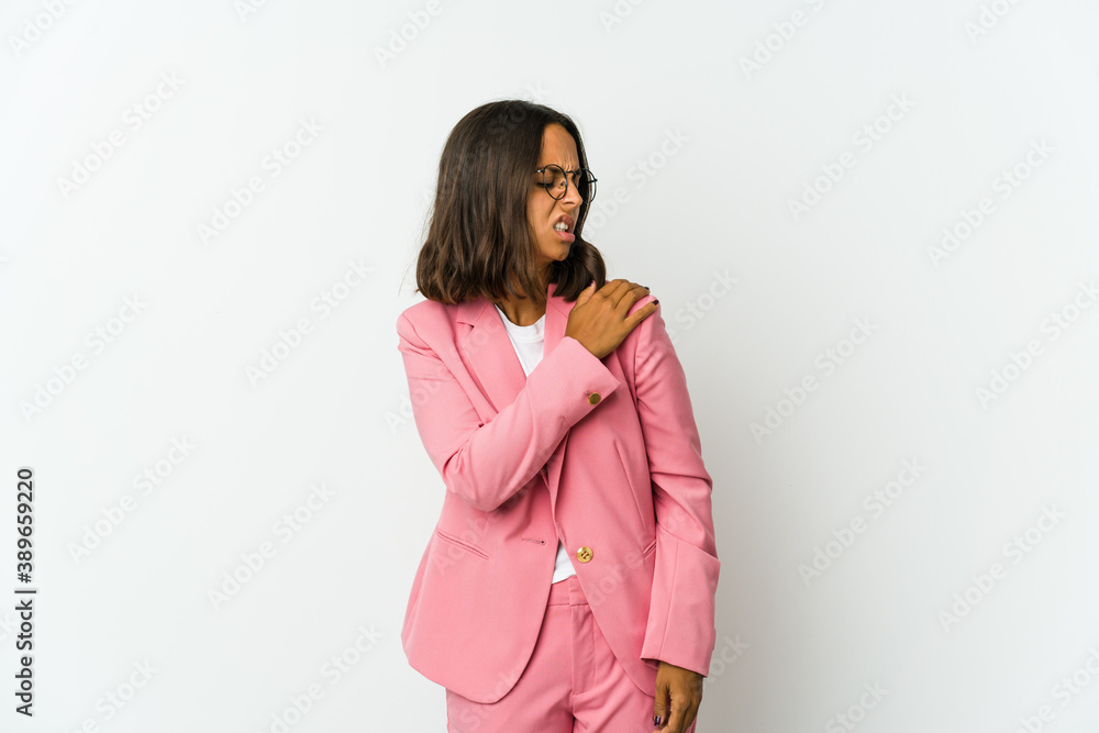 Young latin business woman isolated on white background massaging elbow, suffering after a bad movement. Young latin business woman isolated on white background massaging elbow, suffering after a bad movement.