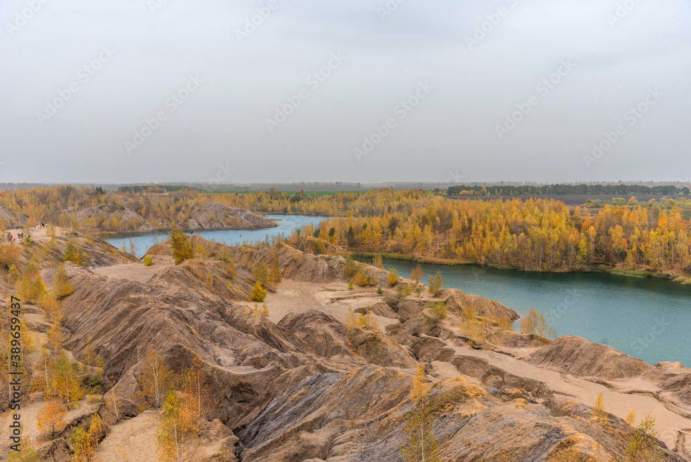 Aerial autumn view of picturesque hills and blue lakes in Konduki, Tula region, Russia.