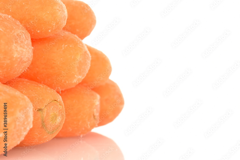 Ripe juicy organic mini carrots, close-up, on a white background. Ripe juicy organic mini carrots, close-up, on a white background.