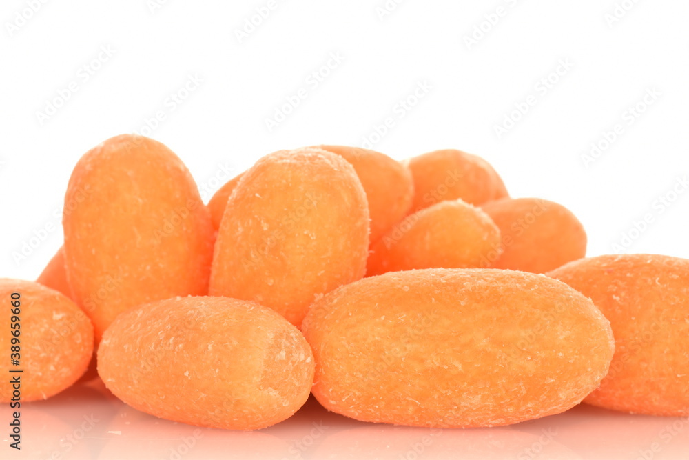 Ripe juicy organic mini carrots, close-up, on a white background.