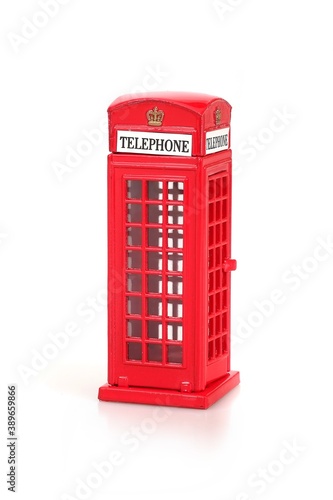 The famous English Red telephone box. Miniature layout isolated on a white background