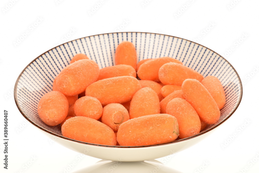 Ripe juicy organic mini carrots, close-up, on a white background. Ripe juicy organic mini carrots, close-up, on a white background.
