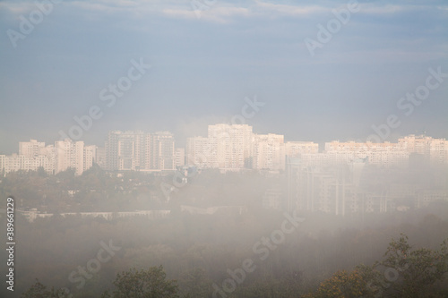 Bright highrise residential buildings in the fog