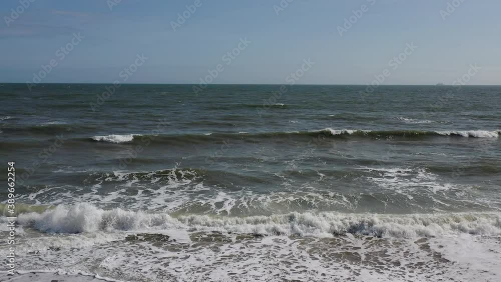 Virginia Beach drone shot coming from the beach flying straight out into the ocean. Sunny day, clear sky. Virginia Beach drone shot coming from the beach flying straight out into the ocean. Sunny day, clear sky.