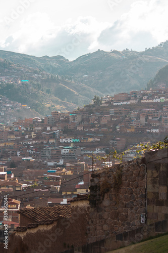 city in a valley surrounded by mountains