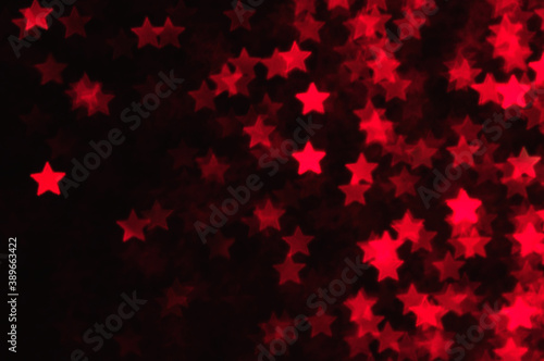Blue holiday glitter background with stars bokeh.