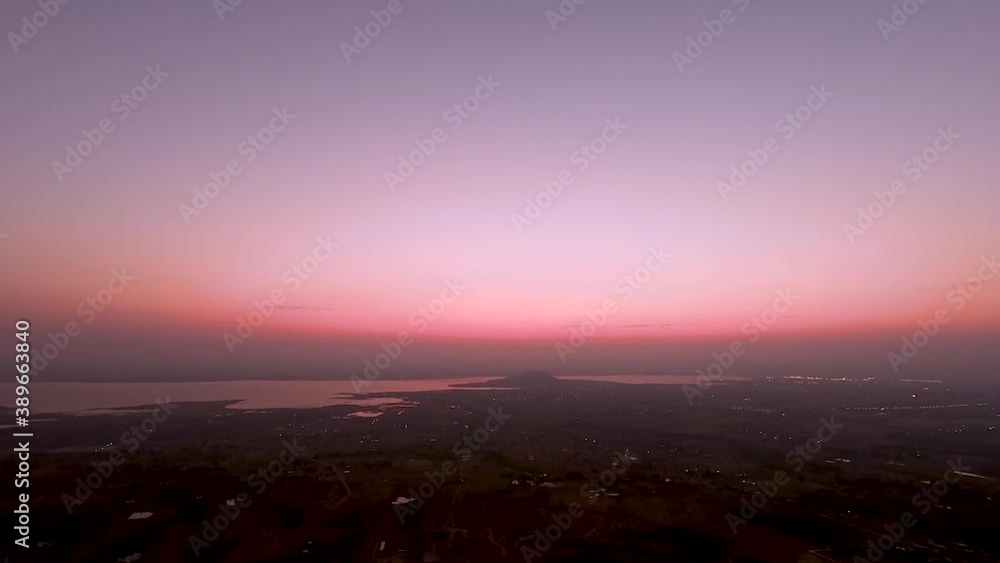 Time lapse Dawning sky over the lake of Pa Sak Jolasid dam and light from the city at Lopburi province amazing Thailand, View from Khao Phra Ya Dern Thong viewpoint. Time lapse Dawning sky over the lake of Pa Sak Jolasid dam and light from the city at Lopburi province amazing Thailand, View from Khao Phra Ya Dern Thong viewpoint.