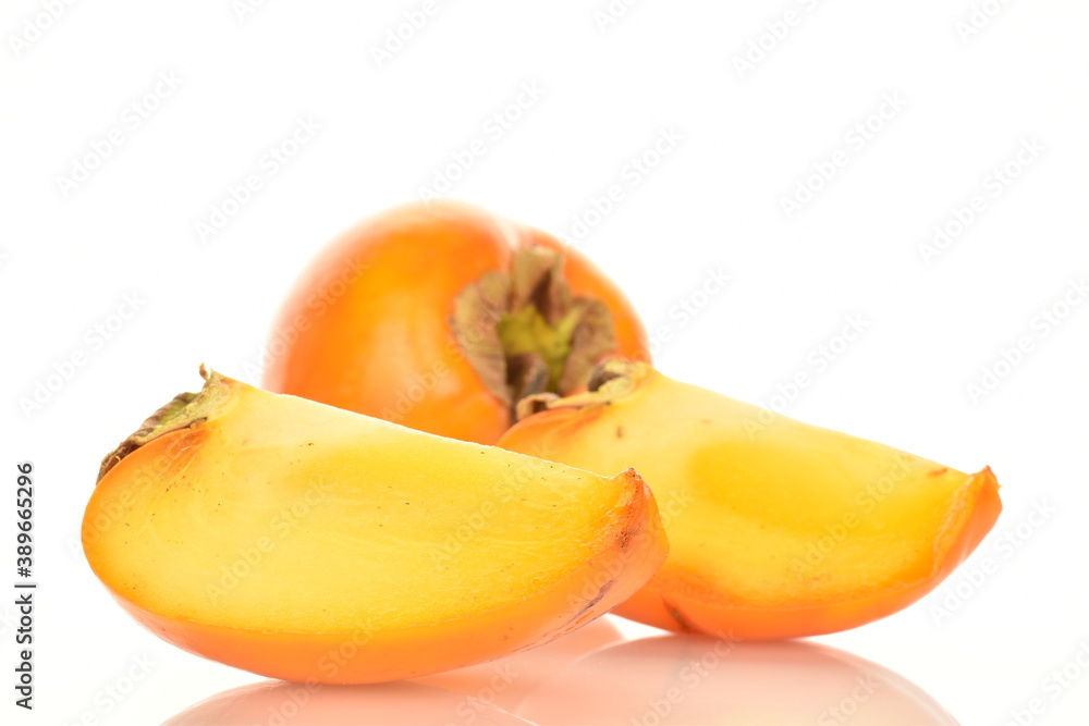 Ripe juicy organic persimmon, close-up, on a white background.