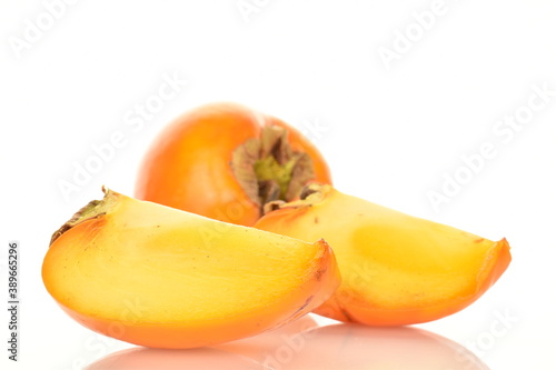 Ripe juicy organic persimmon, close-up, on a white background.