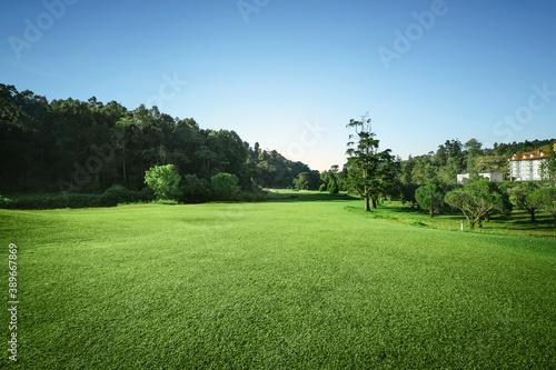 Sunrise golf course with blue sky photo